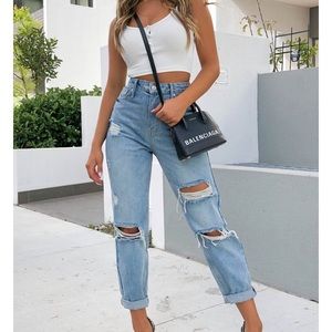 Distressed love stoned retro wash jeans.